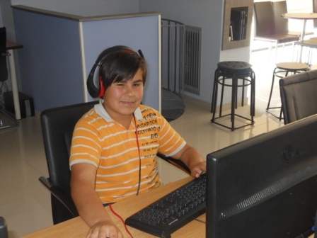 kid enjoy gaming at escape net cafe